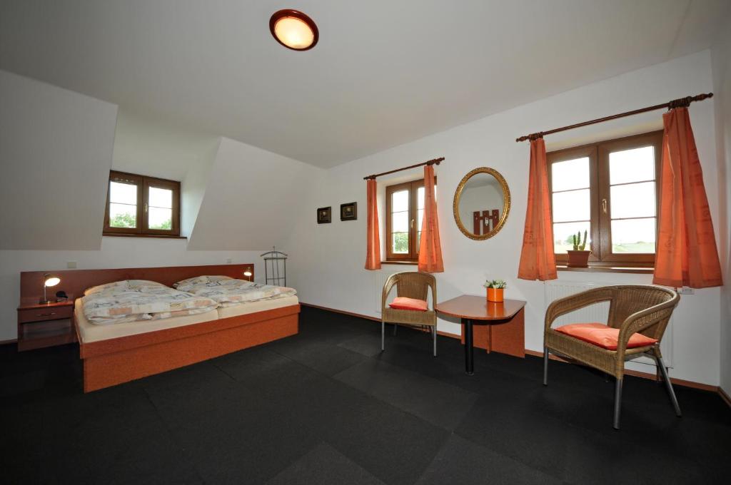Postel nebo postele na pokoji v ubytování Penzion Praktik Krumlov