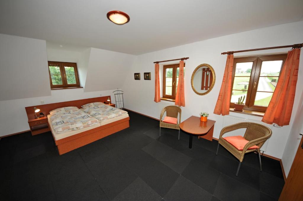 Postel nebo postele na pokoji v ubytování Penzion Praktik Krumlov