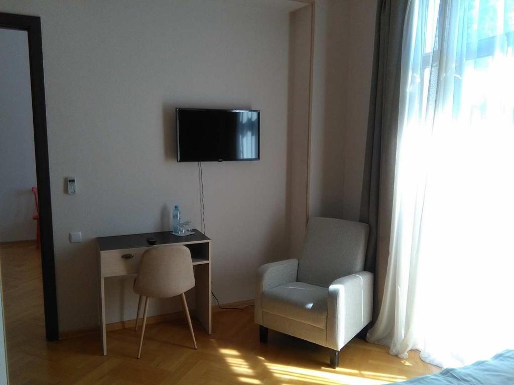 TV a/nebo společenská místnost v ubytování Omsi House