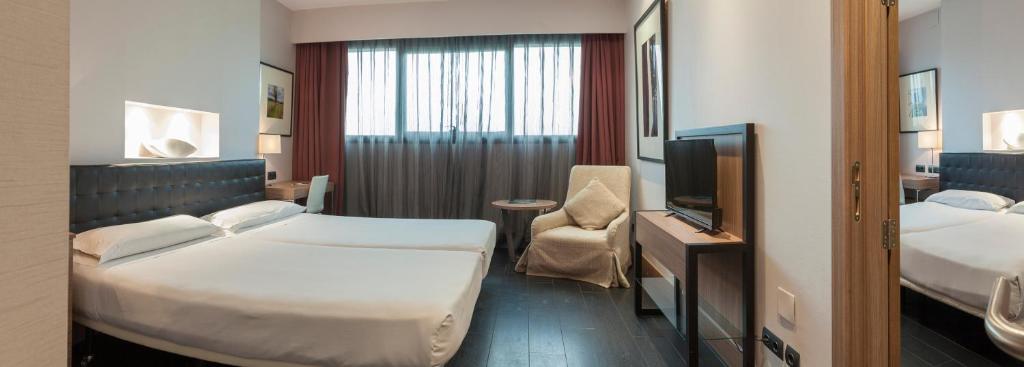 Postel nebo postele na pokoji v ubytování URH Hotel Spa Zen Balagares