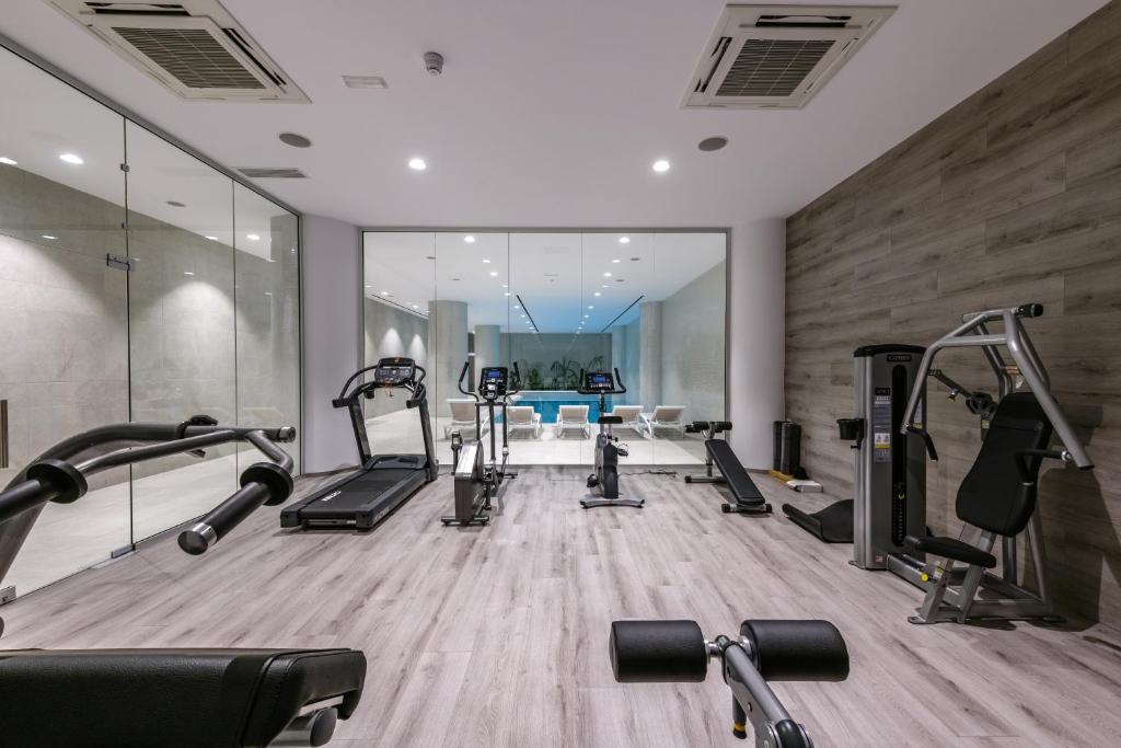 a gym with several treadmills and cardio machines at Seasons Hotel (Adults Only) in Ayia Napa