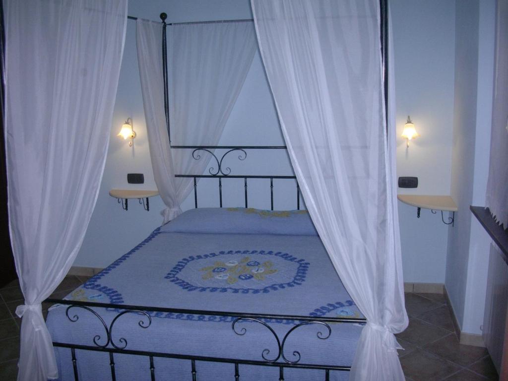 Postel nebo postele na pokoji v ubytování B&B Oasi Verde
