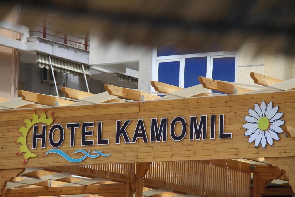 a hotel kamundi sign on the front of a building at Hotel Kamomil in Durrës