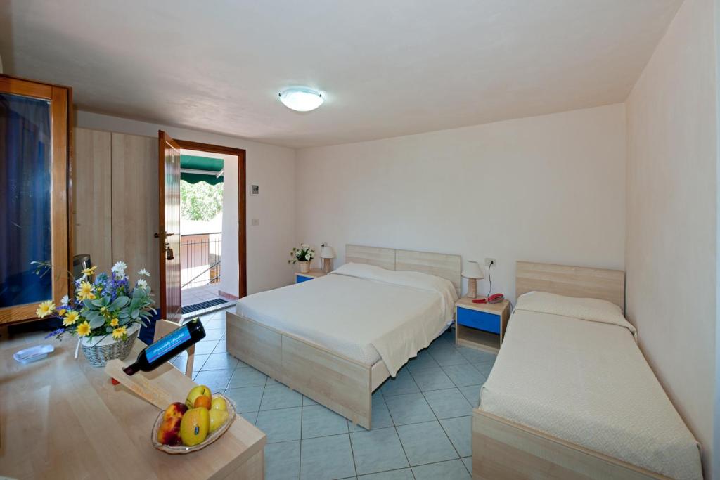 Postel nebo postele na pokoji v ubytování Hotel Casa Rosa