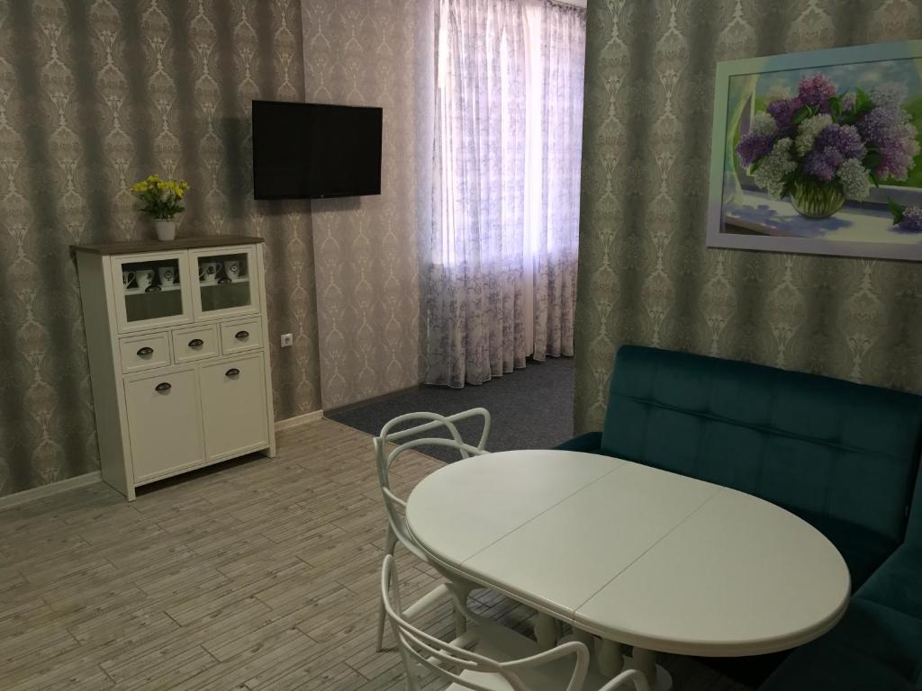 TV a/nebo společenská místnost v ubytování Happy Cat