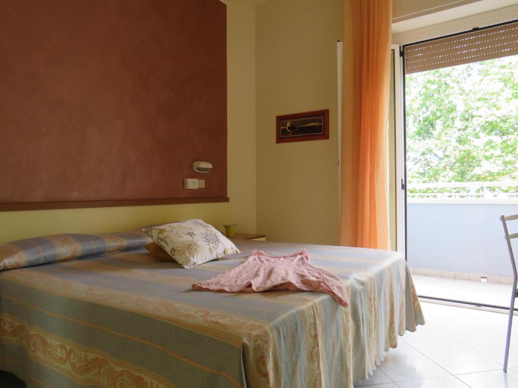 Postel nebo postele na pokoji v ubytování Hotel Solidea