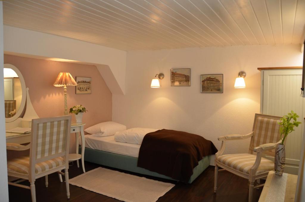 Postel nebo postele na pokoji v ubytování Hotel Graupner