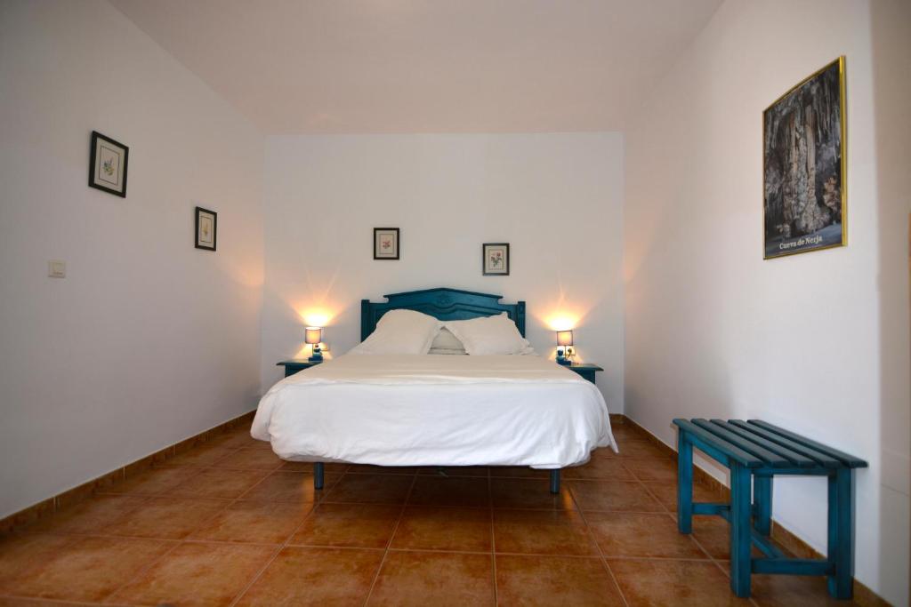Postel nebo postele na pokoji v ubytování Hotel Al-Andalus