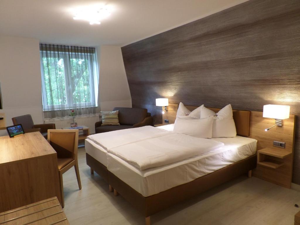 Postel nebo postele na pokoji v ubytování C-YOU Hotel Chemnitz