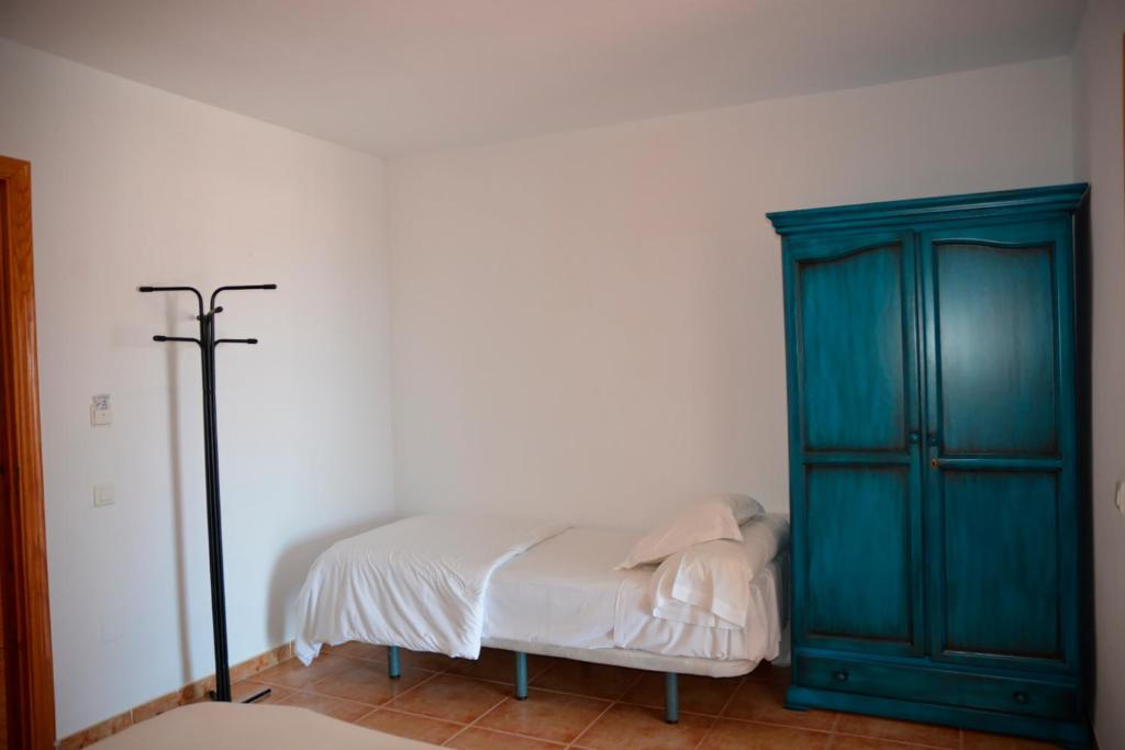 Postel nebo postele na pokoji v ubytování Hotel Al-Andalus