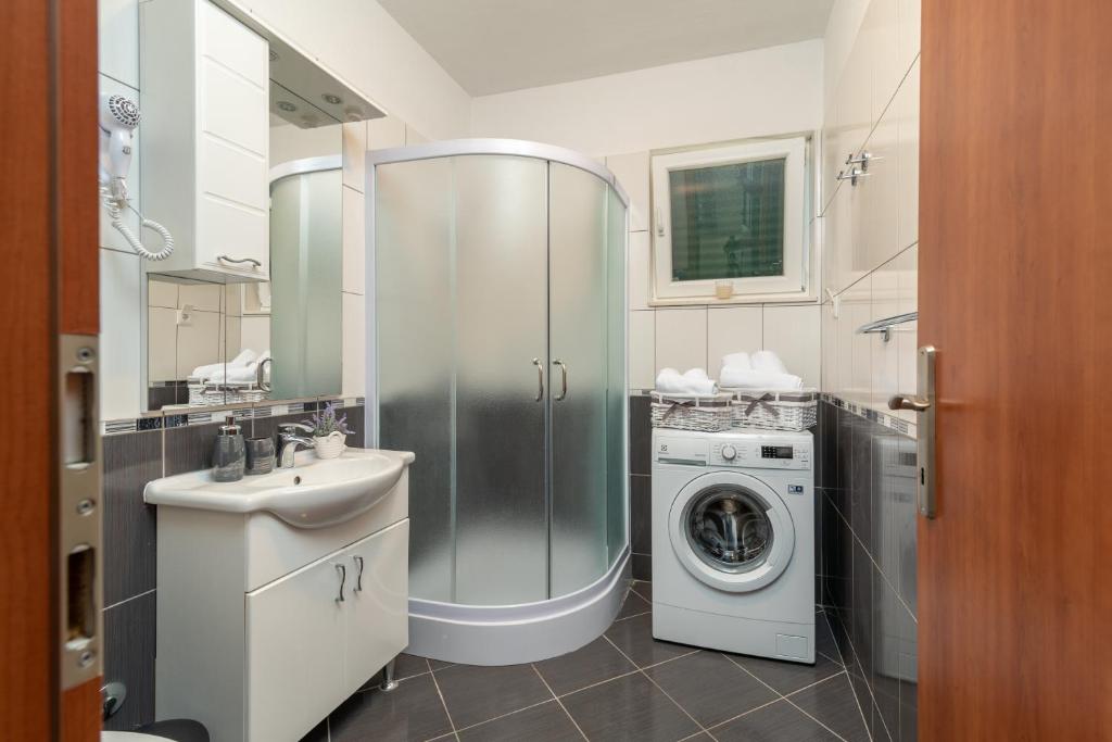 Kuchyň nebo kuchyňský kout v ubytování Apartments Villa Jelena