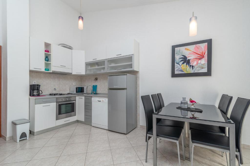 Kuchyň nebo kuchyňský kout v ubytování Apartments Villa Jelena
