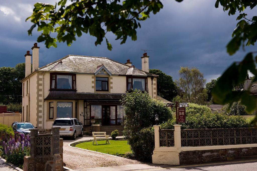 a house with a car parked in front of it at "Room only" at Wetherby Nairn in Nairn