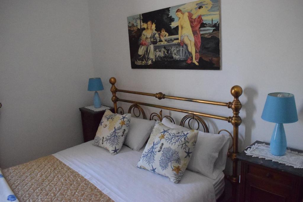 A bed or beds in a room at B&b Lemon Garden
