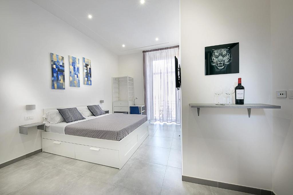 Ένα ή περισσότερα κρεβάτια σε δωμάτιο στο President Suites