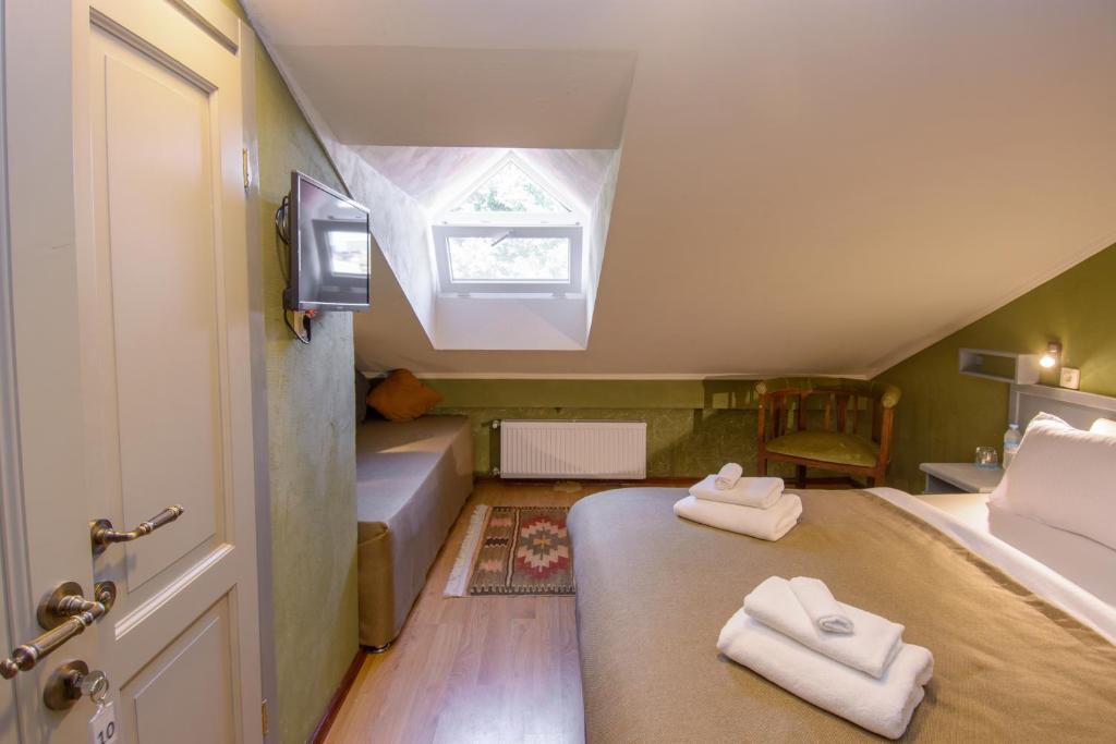 Postel nebo postele na pokoji v ubytování Kindli Boutique Hotel