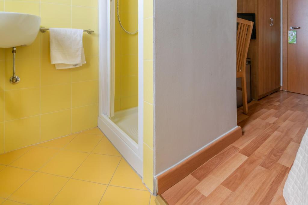 Postel nebo postele na pokoji v ubytování Hotel Stresa