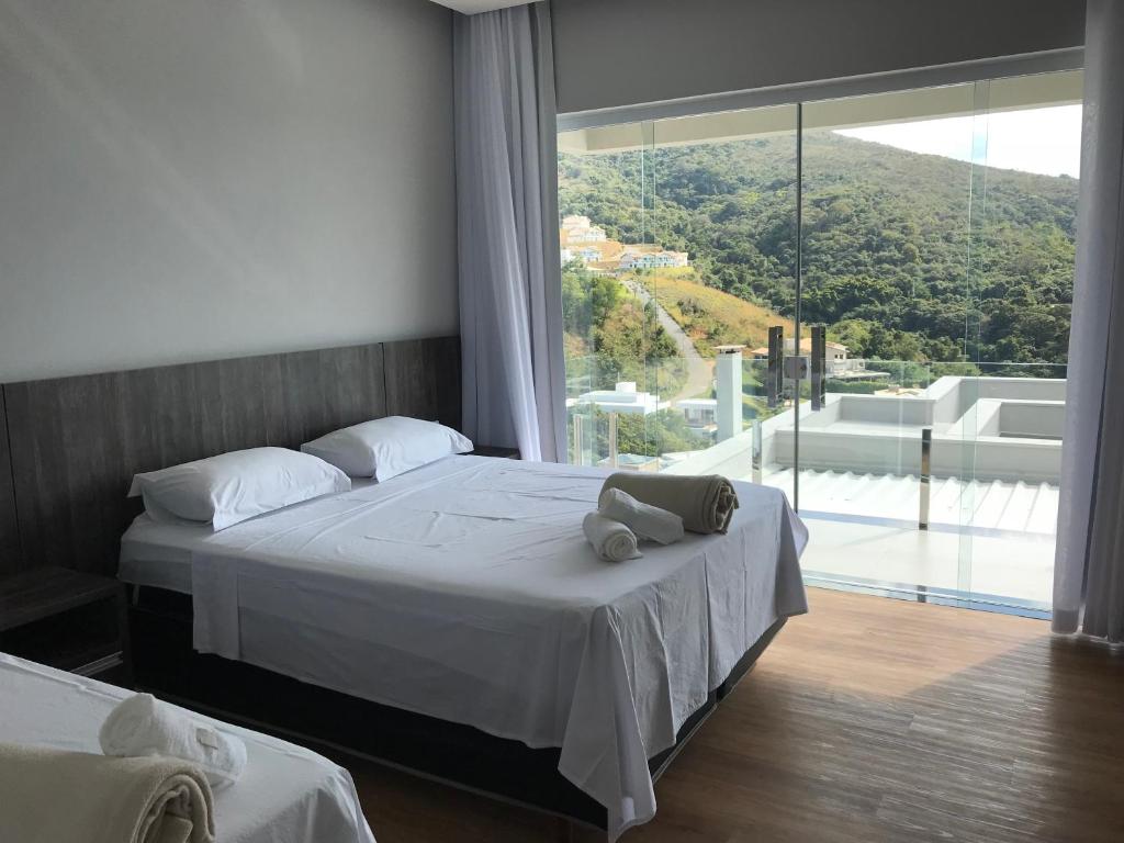 Postel nebo postele na pokoji v ubytování Suítes de Luxo Paraíso de Minas Escarpas