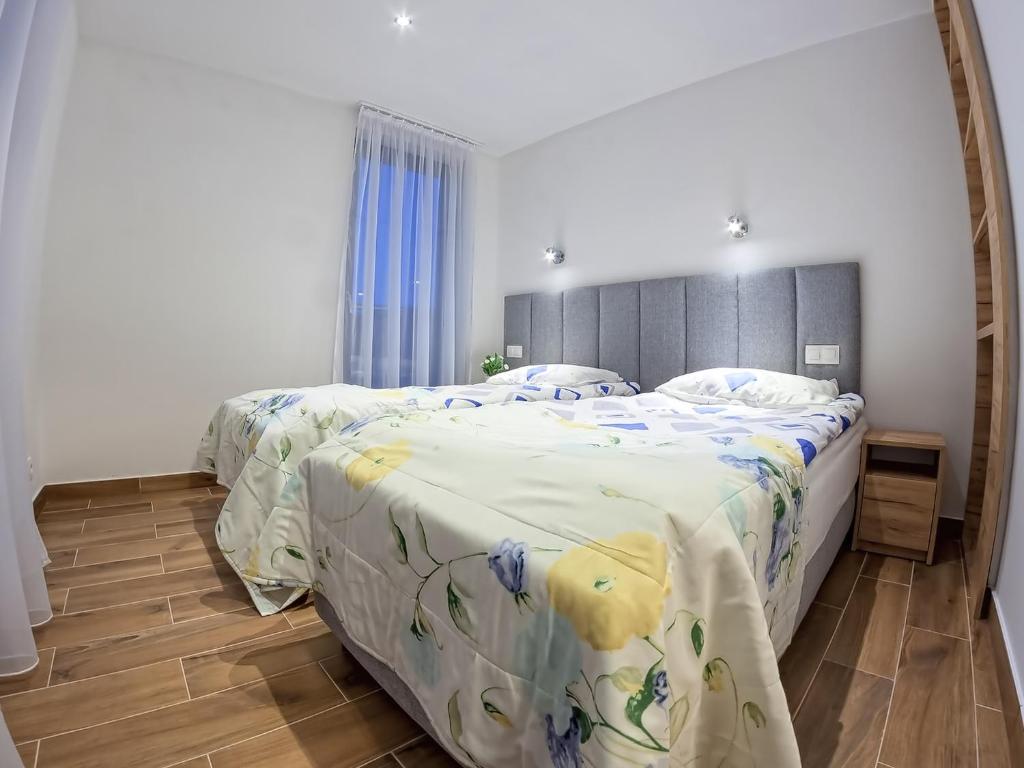 Posteľ alebo postele v izbe v ubytovaní Wicie Residence