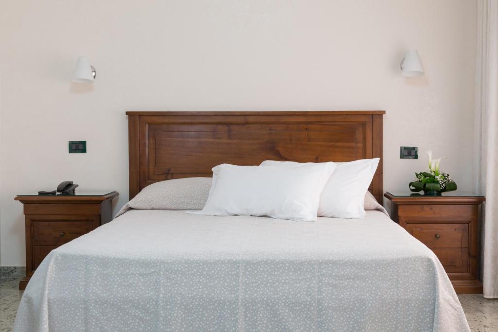 Postel nebo postele na pokoji v ubytování Hotel Arcobaleno