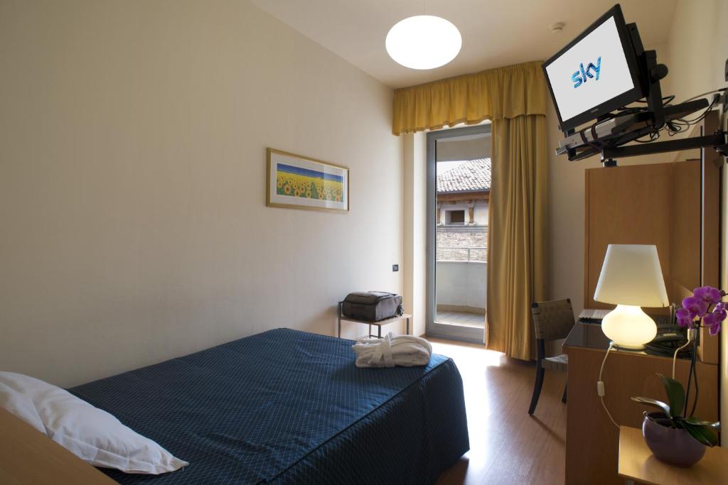 Posteľ alebo postele v izbe v ubytovaní Hotel Masini