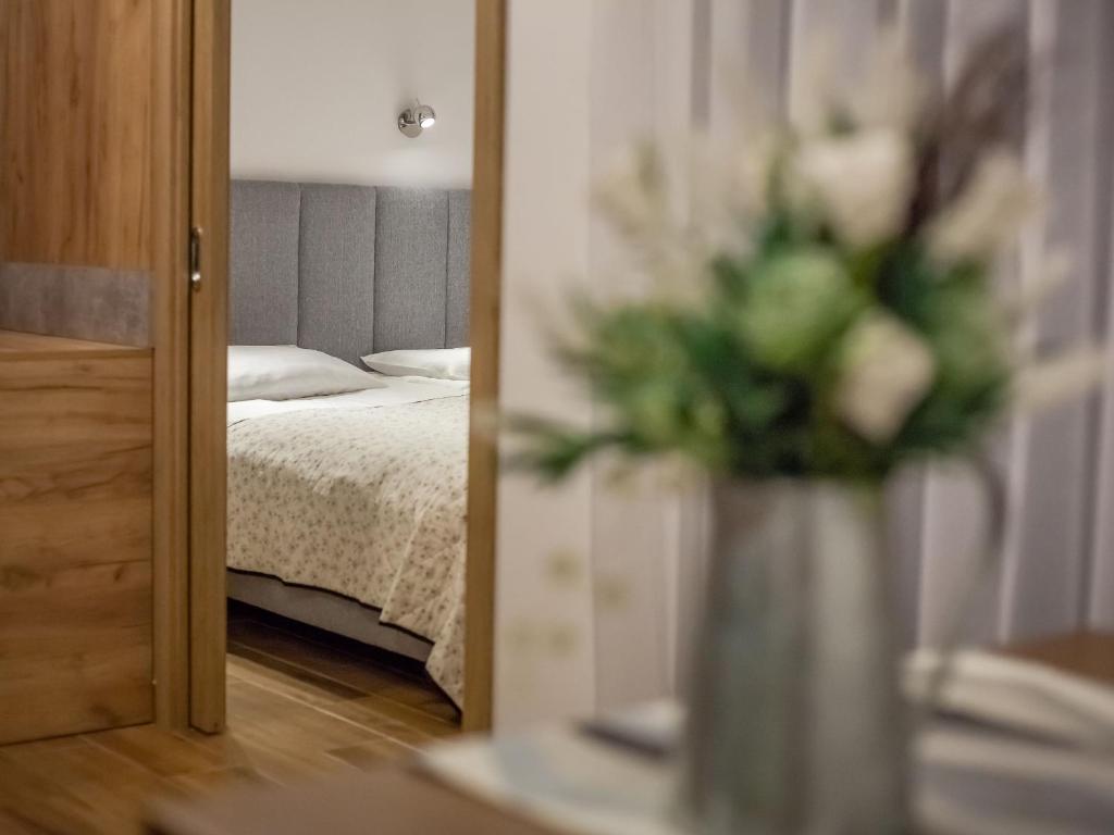 Posteľ alebo postele v izbe v ubytovaní Wicie Residence