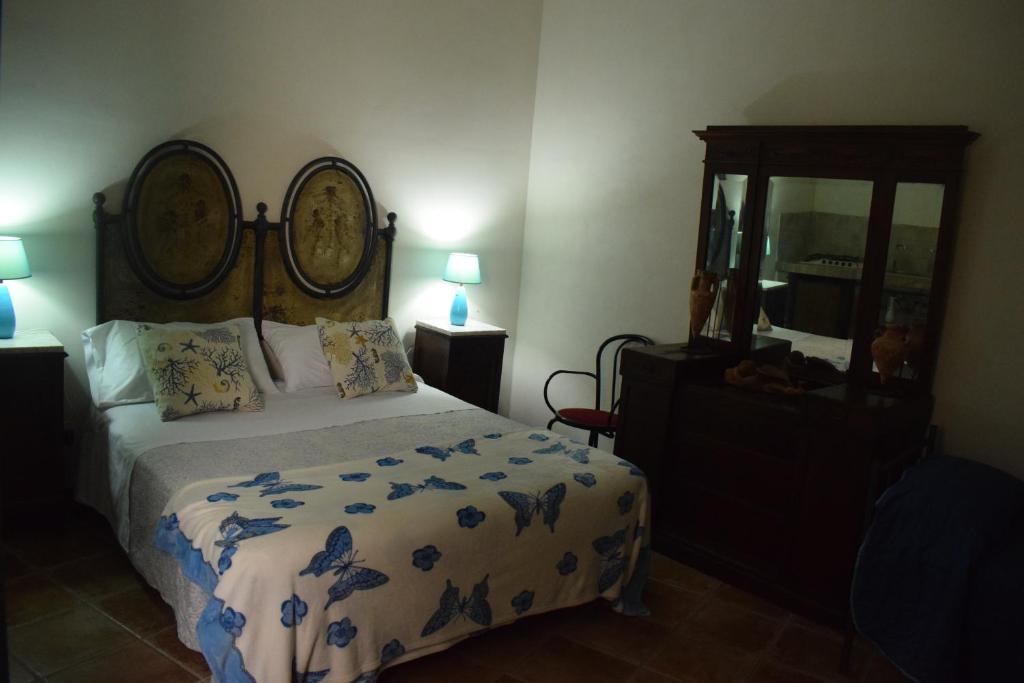 A bed or beds in a room at B&b Lemon Garden
