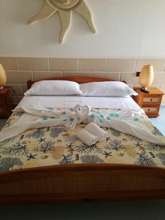 Postel nebo postele na pokoji v ubytování Angolo di Paradiso