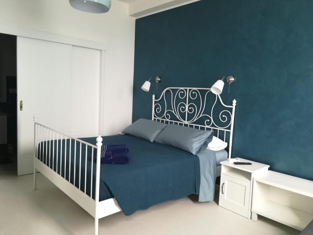 Postel nebo postele na pokoji v ubytování Guest House Domus Cicerone