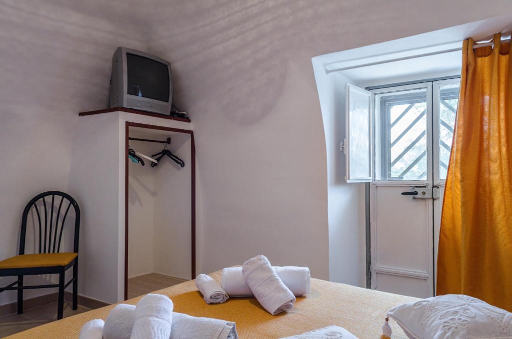 A bed or beds in a room at Corte Regina