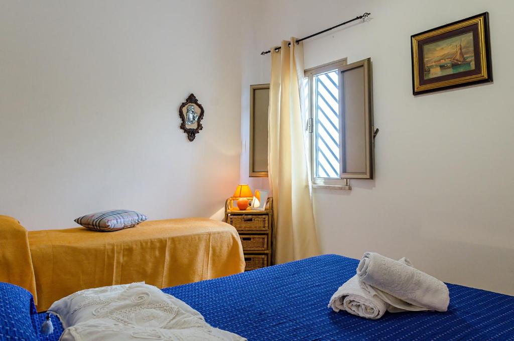 A bed or beds in a room at Corte Regina