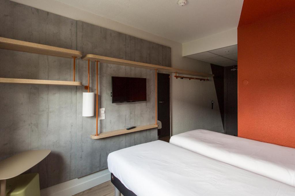 Postel nebo postele na pokoji v ubytování ibis budget Senlis