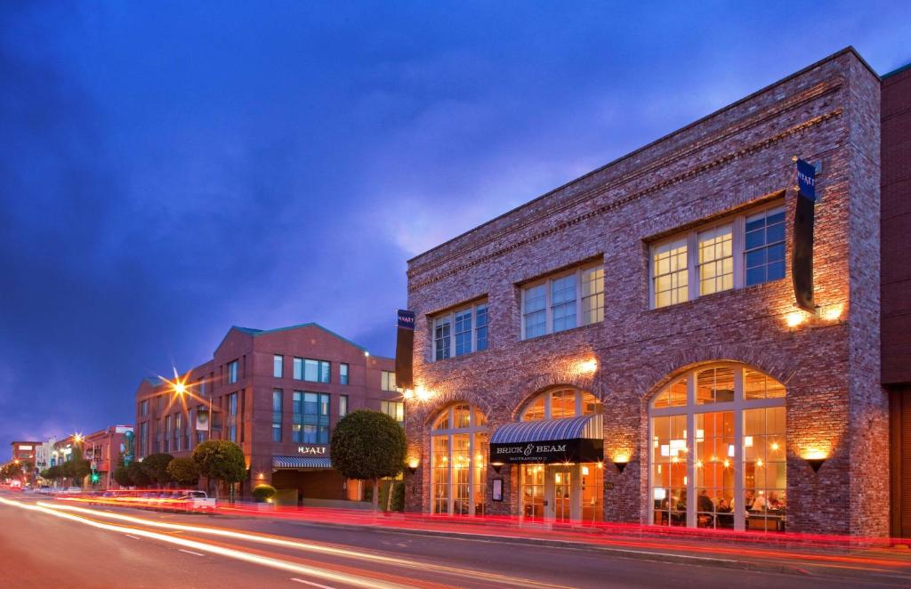 a brick building on a city street at night at Hyatt Centric Fisherman's Wharf San Francisco in San Francisco