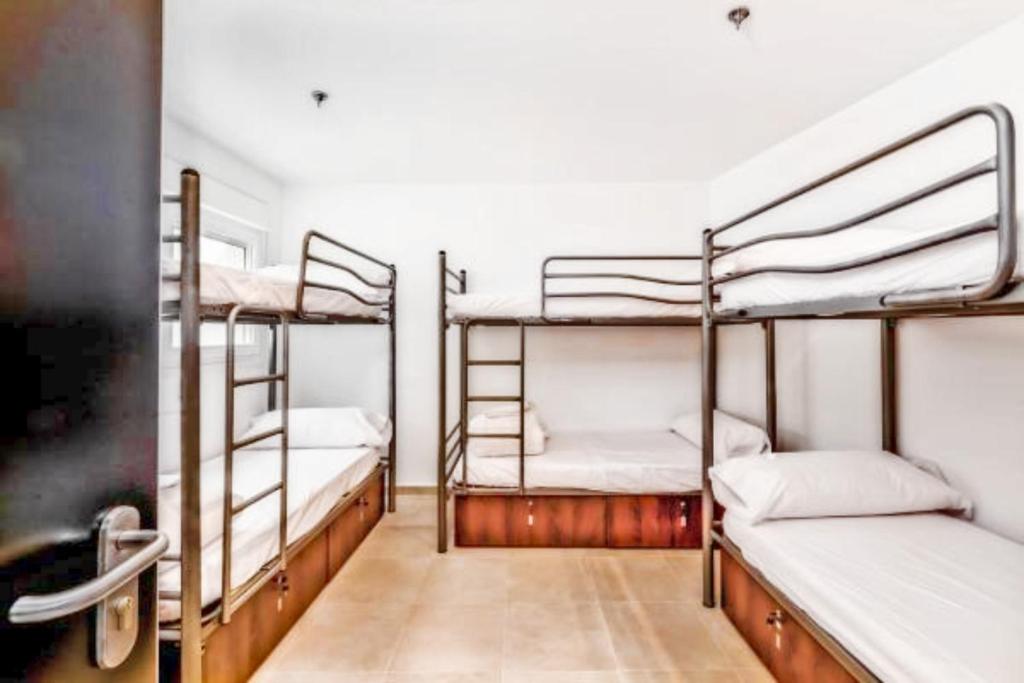 Postel nebo postele na pokoji v ubytování Hostel A2C