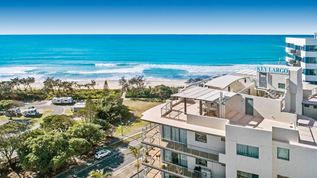an aerial view of a building and the beach at Key Largo Maroochydore in Maroochydore