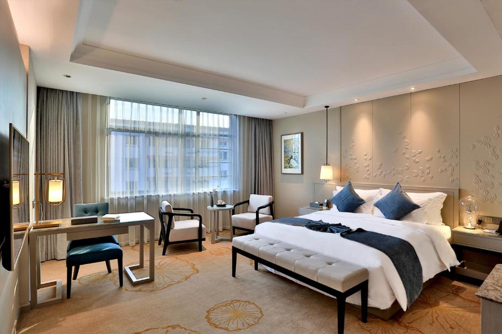 Postel nebo postele na pokoji v ubytování Byland Star Hotel