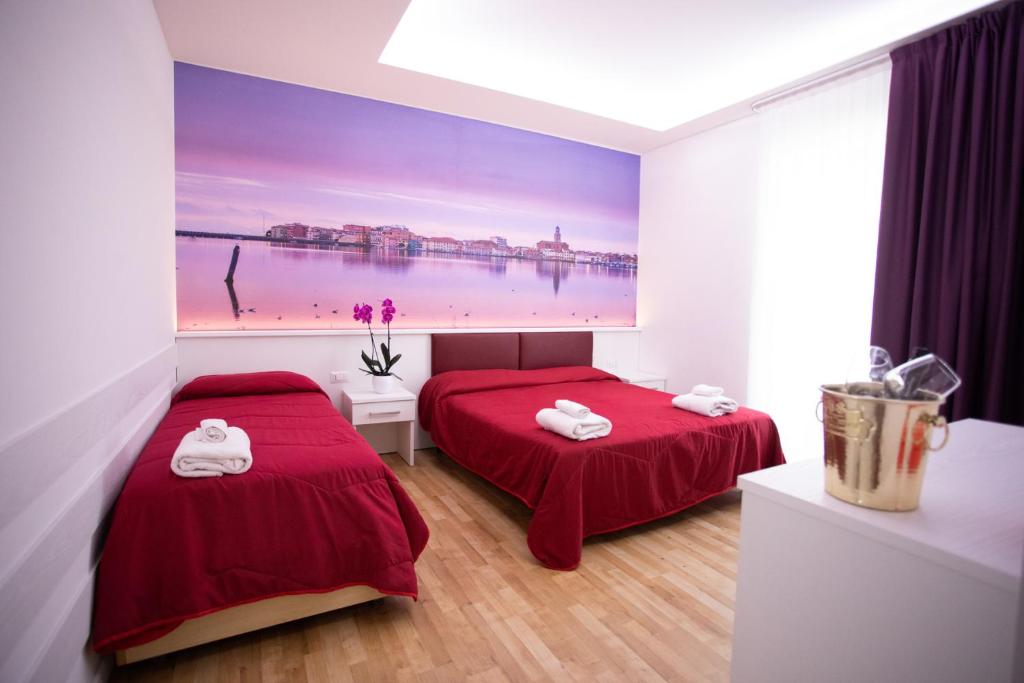 Postel nebo postele na pokoji v ubytování Hotel Ragno D'Oro