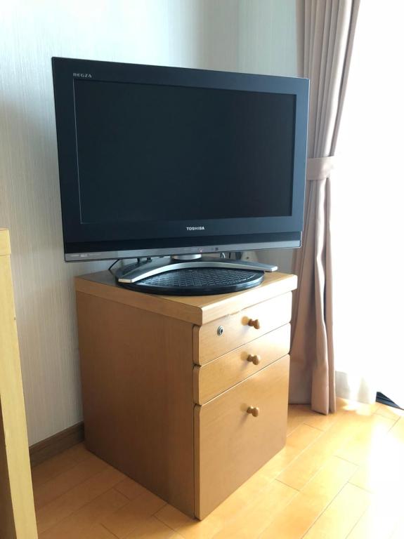 TV a/nebo společenská místnost v ubytování Accecss Tenjin