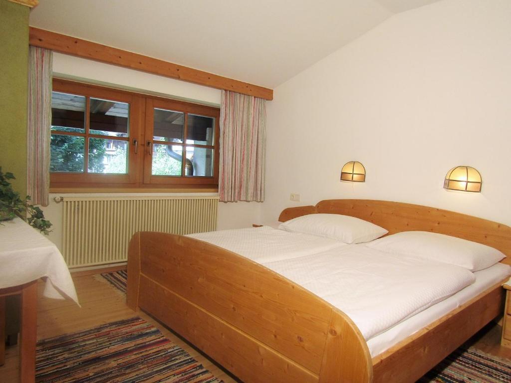 Postel nebo postele na pokoji v ubytování Gästehaus Elfriede