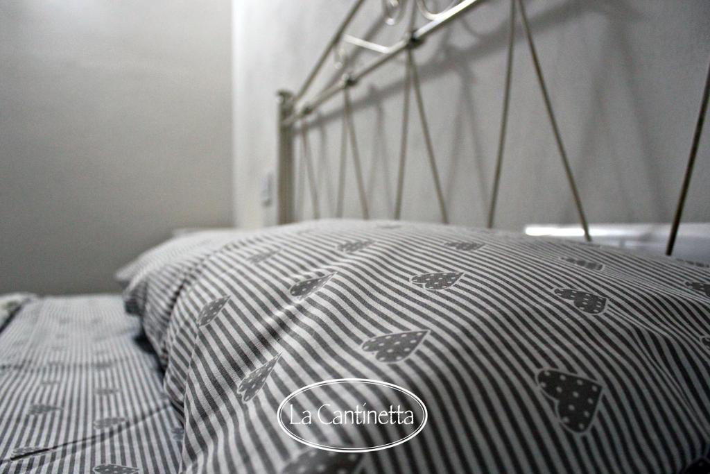 Letto o letti in una camera di B&B La Piazzetta