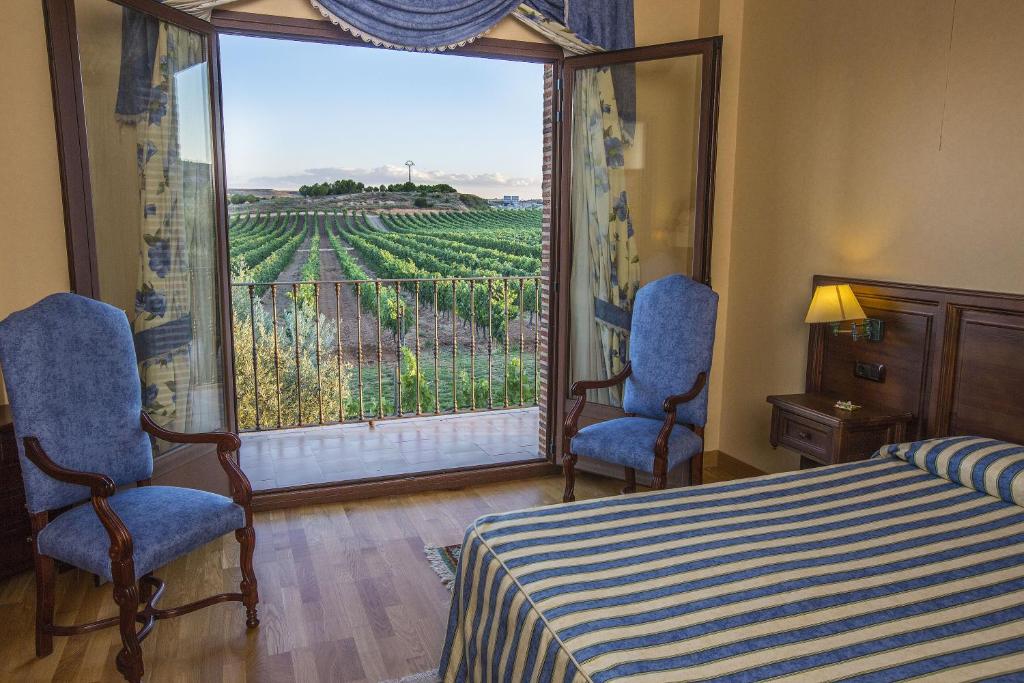 Postel nebo postele na pokoji v ubytování Hotel Spa Tudanca Aranda