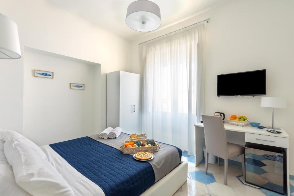 Postel nebo postele na pokoji v ubytování Caruso suite