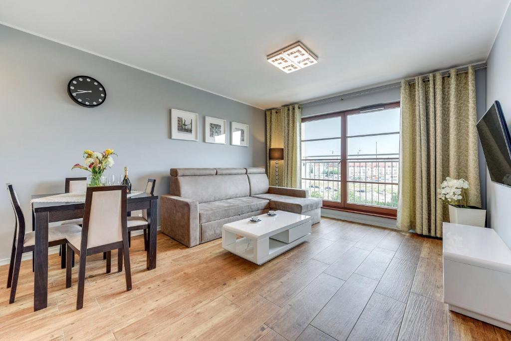 Televízia a/alebo spoločenská miestnosť v ubytovaní GRANO APARTMENTS Gdańsk Motława SPA & Wellness