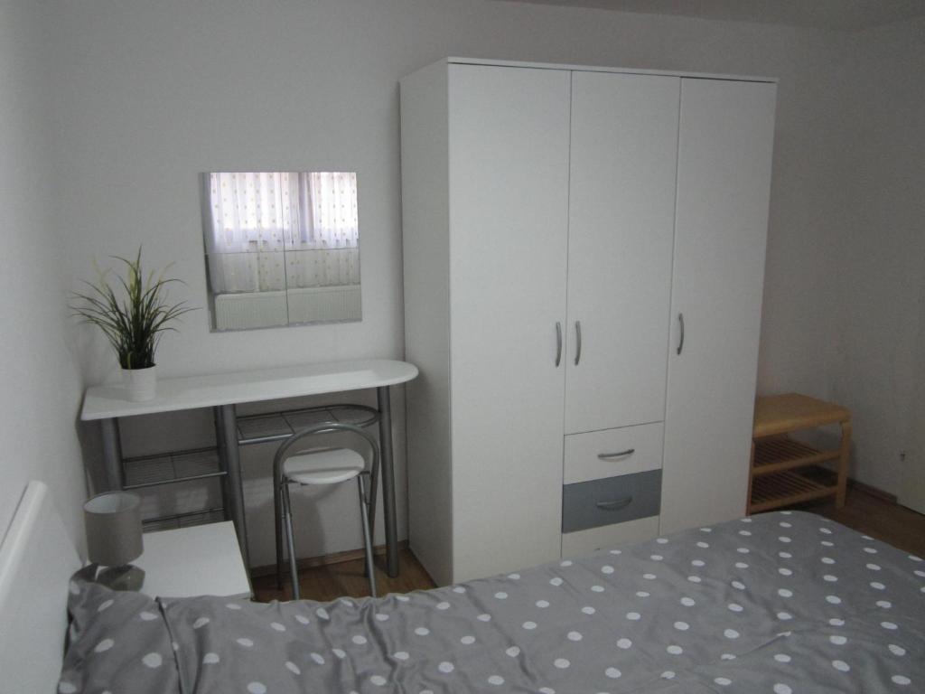 Postel nebo postele na pokoji v ubytování Apartman TIM