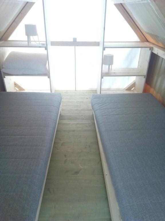 Postel nebo postele na pokoji v ubytování Elbadoc Camping Village
