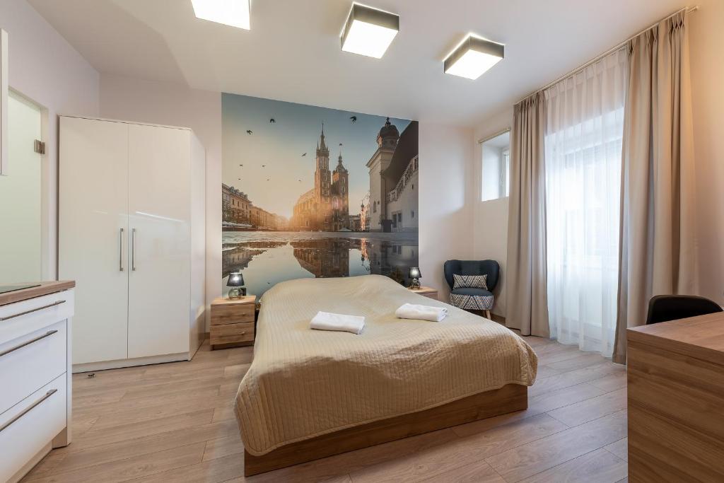 Posteľ alebo postele v izbe v ubytovaní Krakow For You Budget Apartments