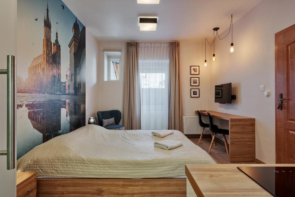 Posteľ alebo postele v izbe v ubytovaní Krakow For You Budget Apartments