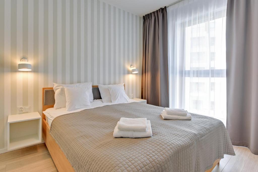 Posteľ alebo postele v izbe v ubytovaní GRANO APARTMENTS Gdańsk Motława SPA & Wellness