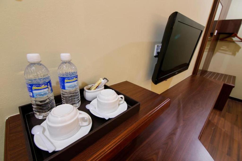 TV a/nebo společenská místnost v ubytování Art Cottage Hotel