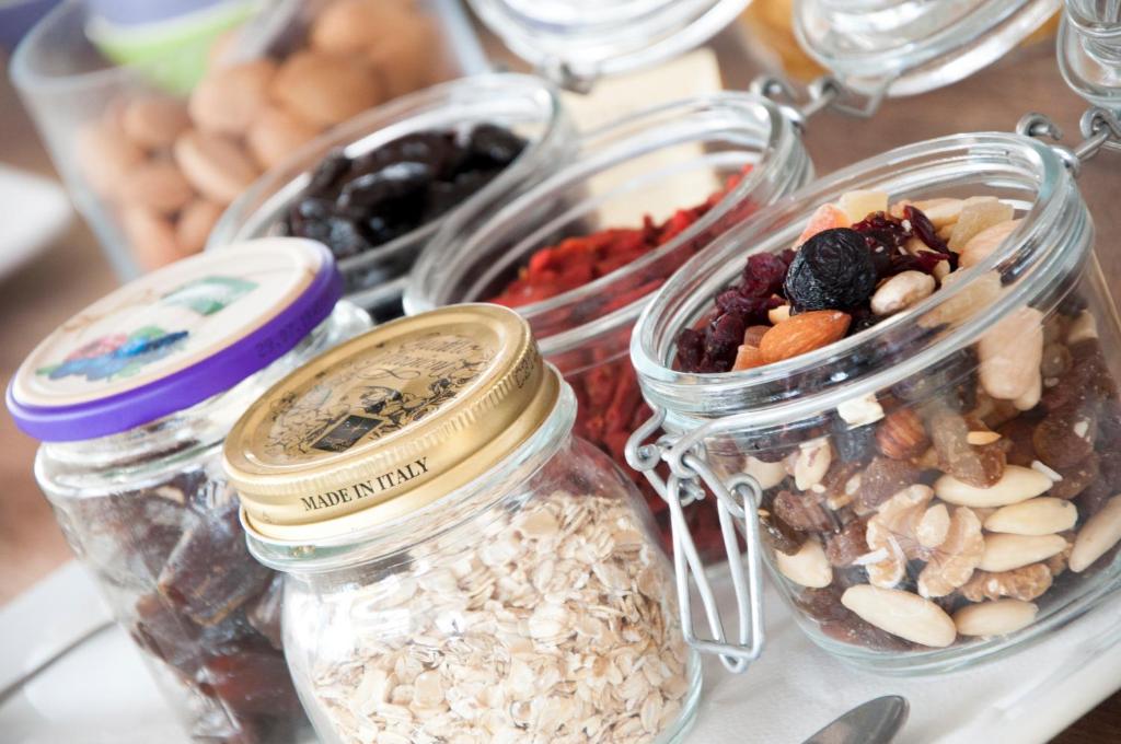 a group of jars filled with different types of food at Hotel del Mar in Sottomarina